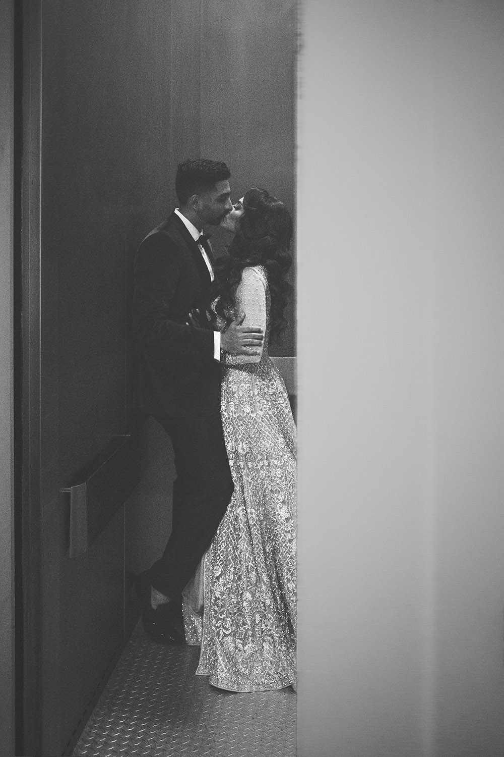 wedding photography luxury fine art goodbye kiss bride and groom at end of reception