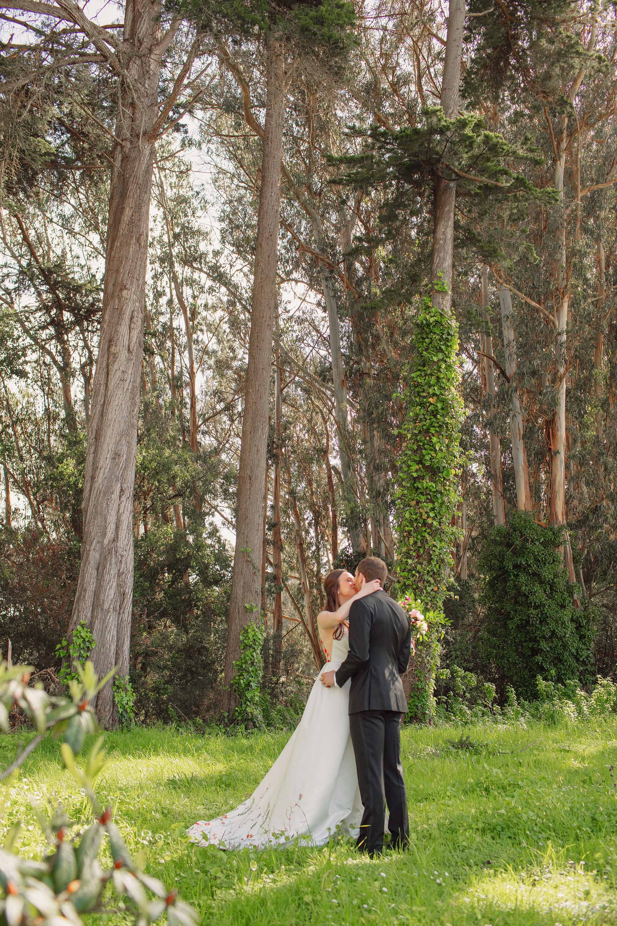 Bride and groom kiss during portrait session in San Francisco Presidio. Credit: Love Knot Photography by Isaac Klotz