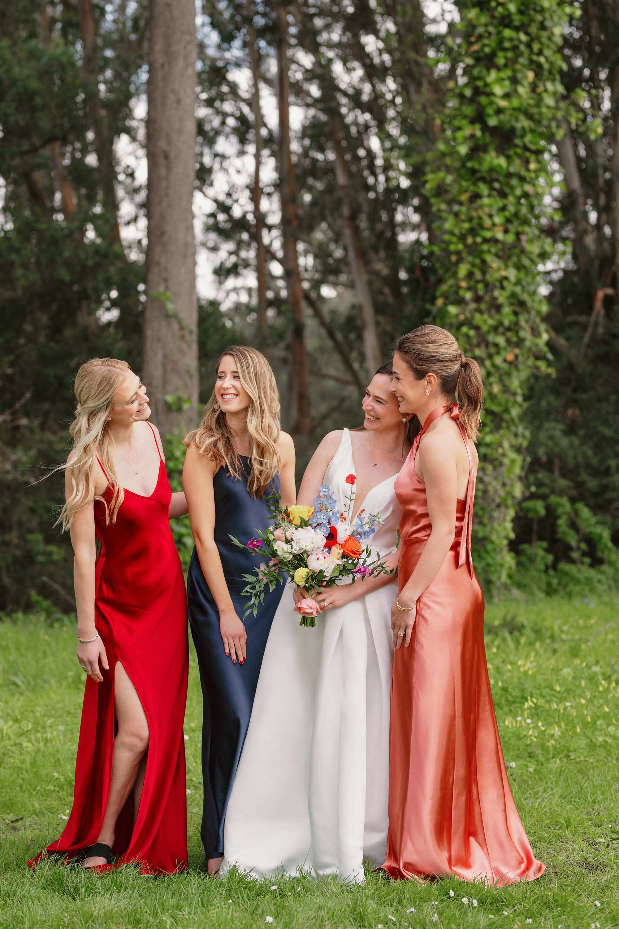 Wedding portraits of bride with her bridesmaids. Moments before wedding ceremony at SF Presidio Golf Course. Credit: Love Knot Photography by Isaac Klotz