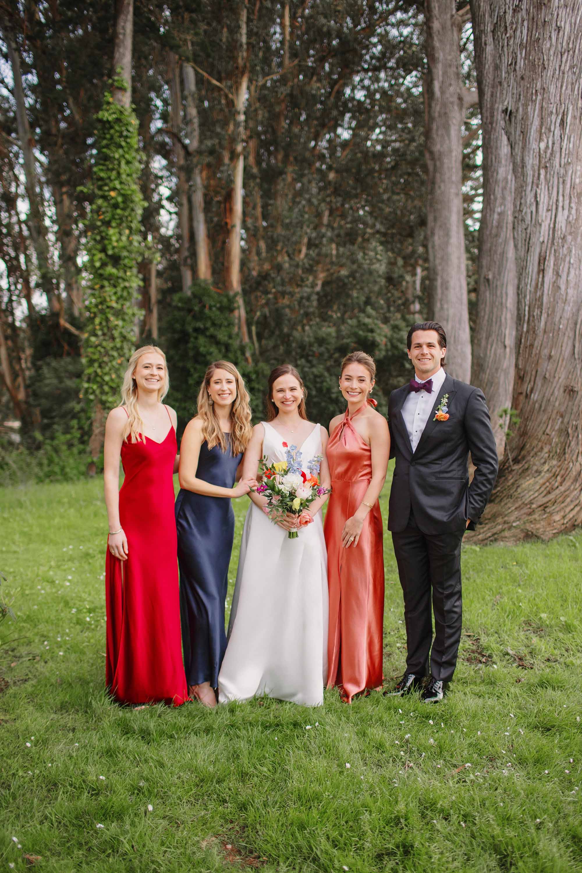 Wedding portrait of bride with her bridal party. Moments before SF Presidio Golf Course wedding. Credit: Love Knot Photography by Isaac Klotz