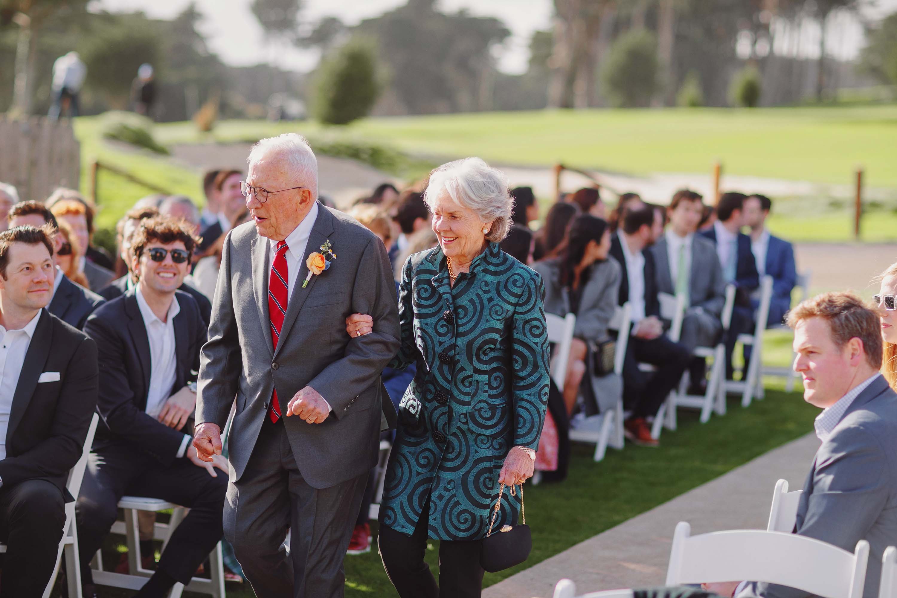 Wedding ceremony begins as grandparents walk the aisle, SF Presidio Golf Course. Credit: Love Knot Photography by Isaac Klotz