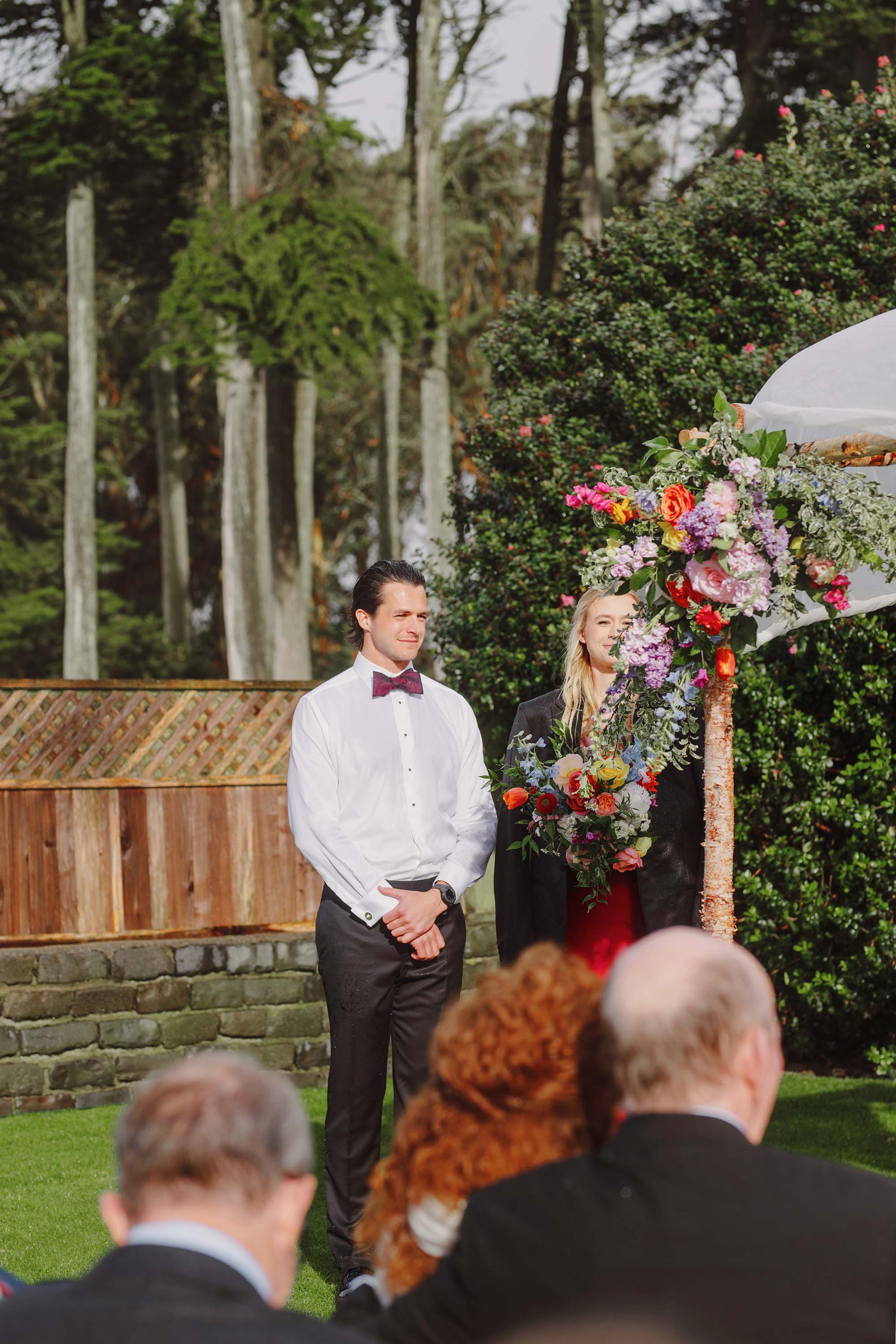 Man gives his coat to the Maid of Honor during this gorgeous wedding ceremony. Credit: Love Knot Photography by Isaac Klotz
