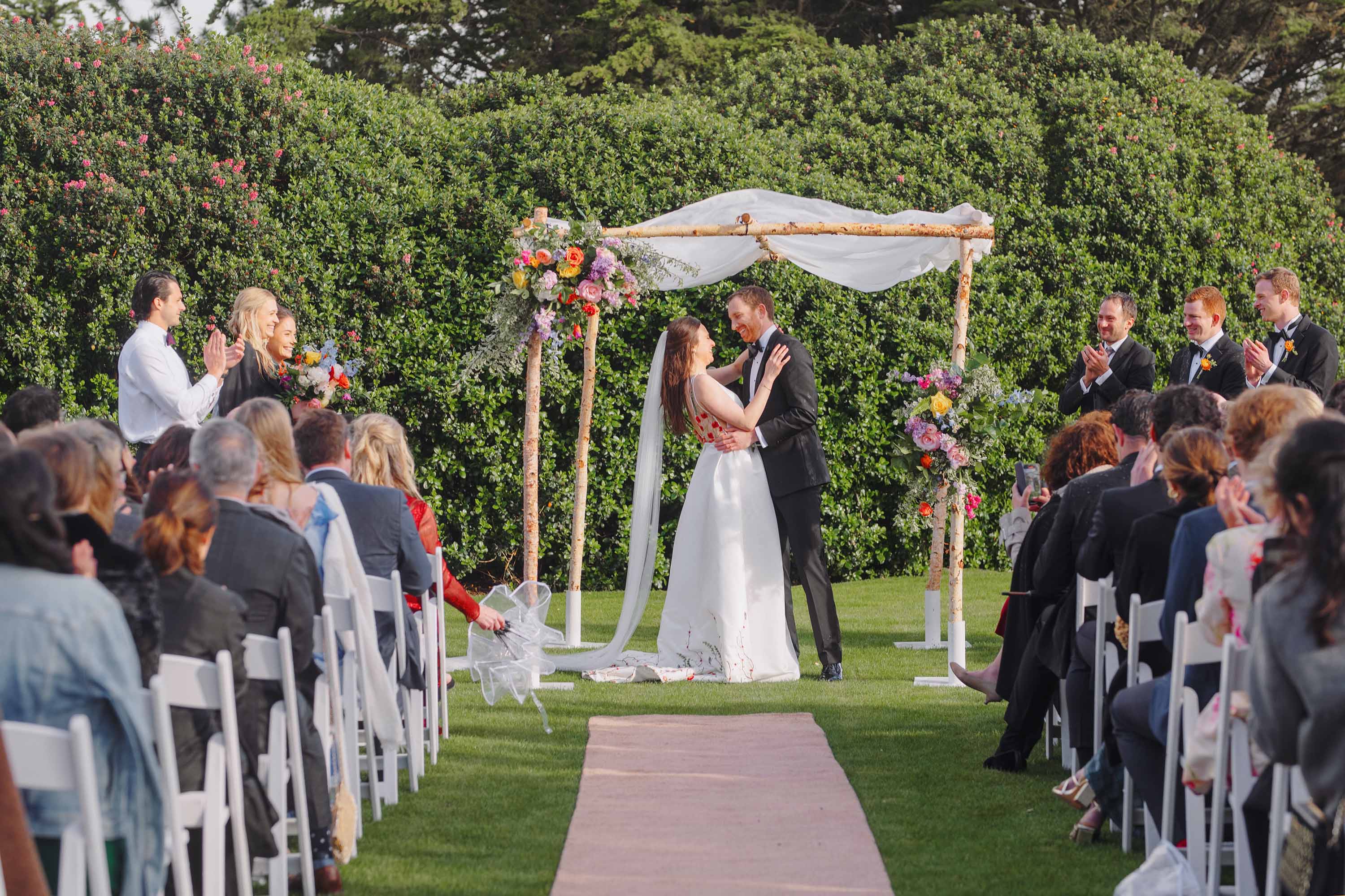 Bride and groom share the joy at their ceremony. Credit: Love Knot Photography by Isaac Klotz