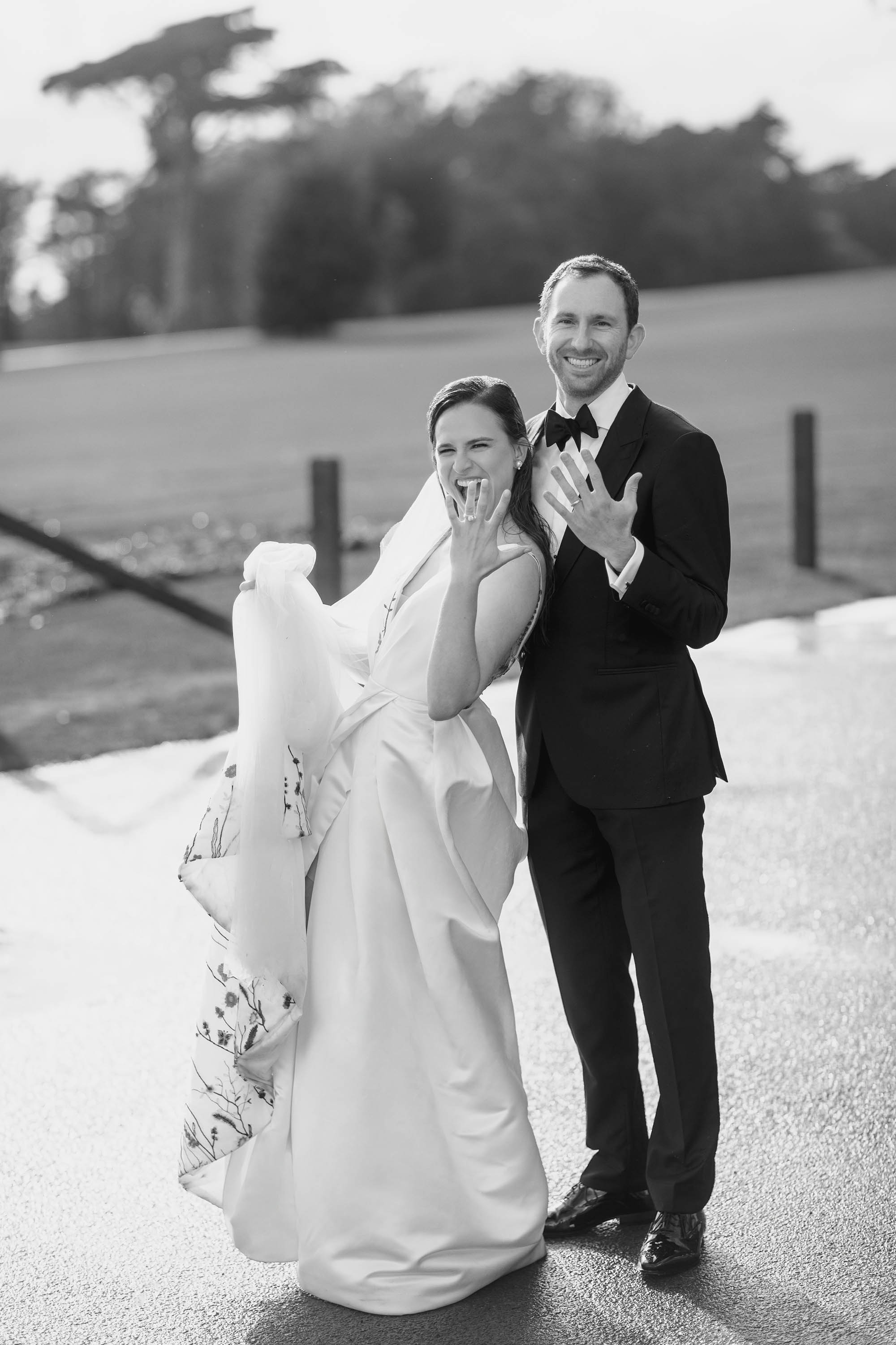 A black and white photo of the bride and groom showing their wedding rings, just married! Credit: Love Knot Photography by Isaac Klotz