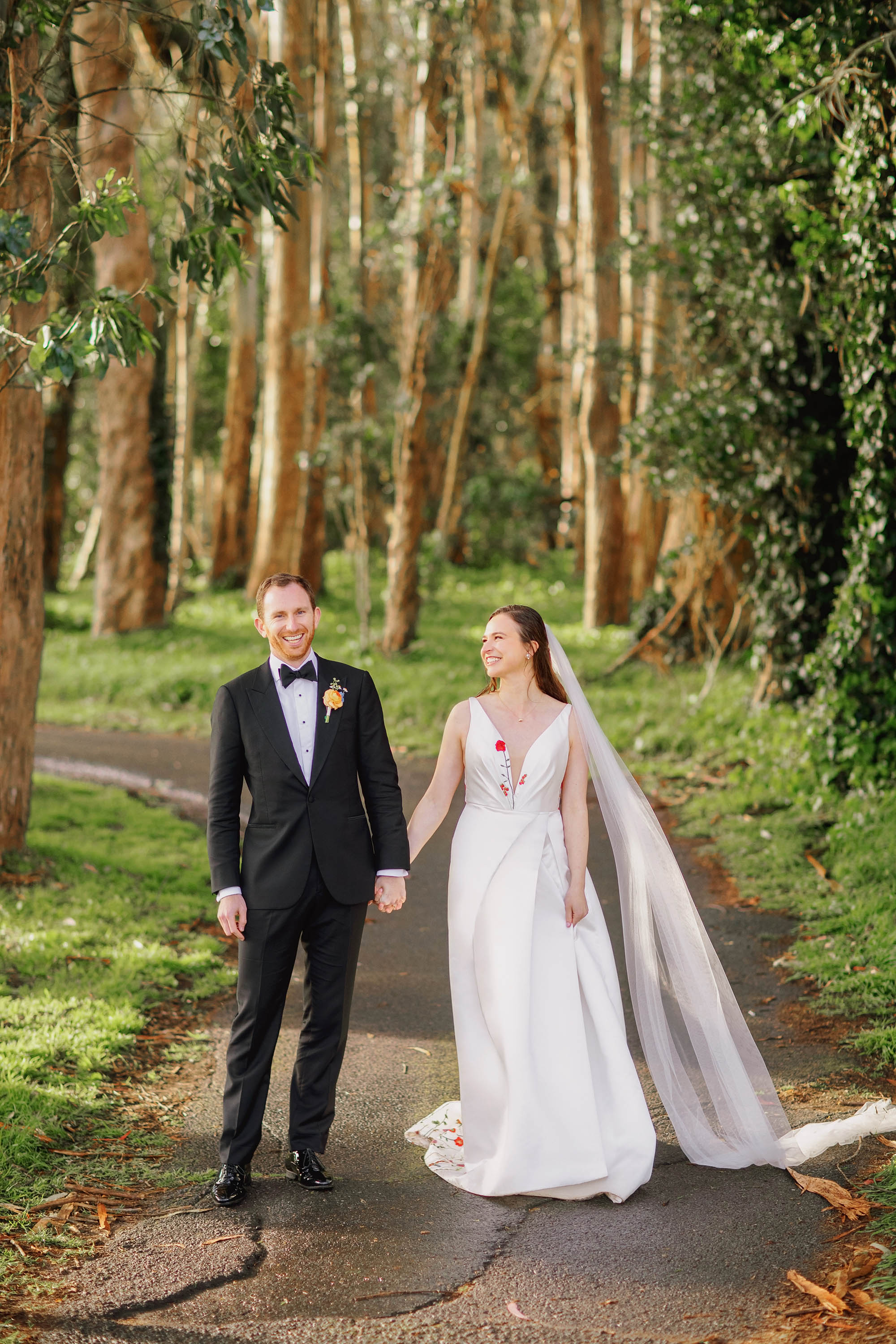 Bride and groom sharing a laugh during their portrait session, SF Presidio Golf Course. Credit: Love Knot Photography by Isaac Klotz