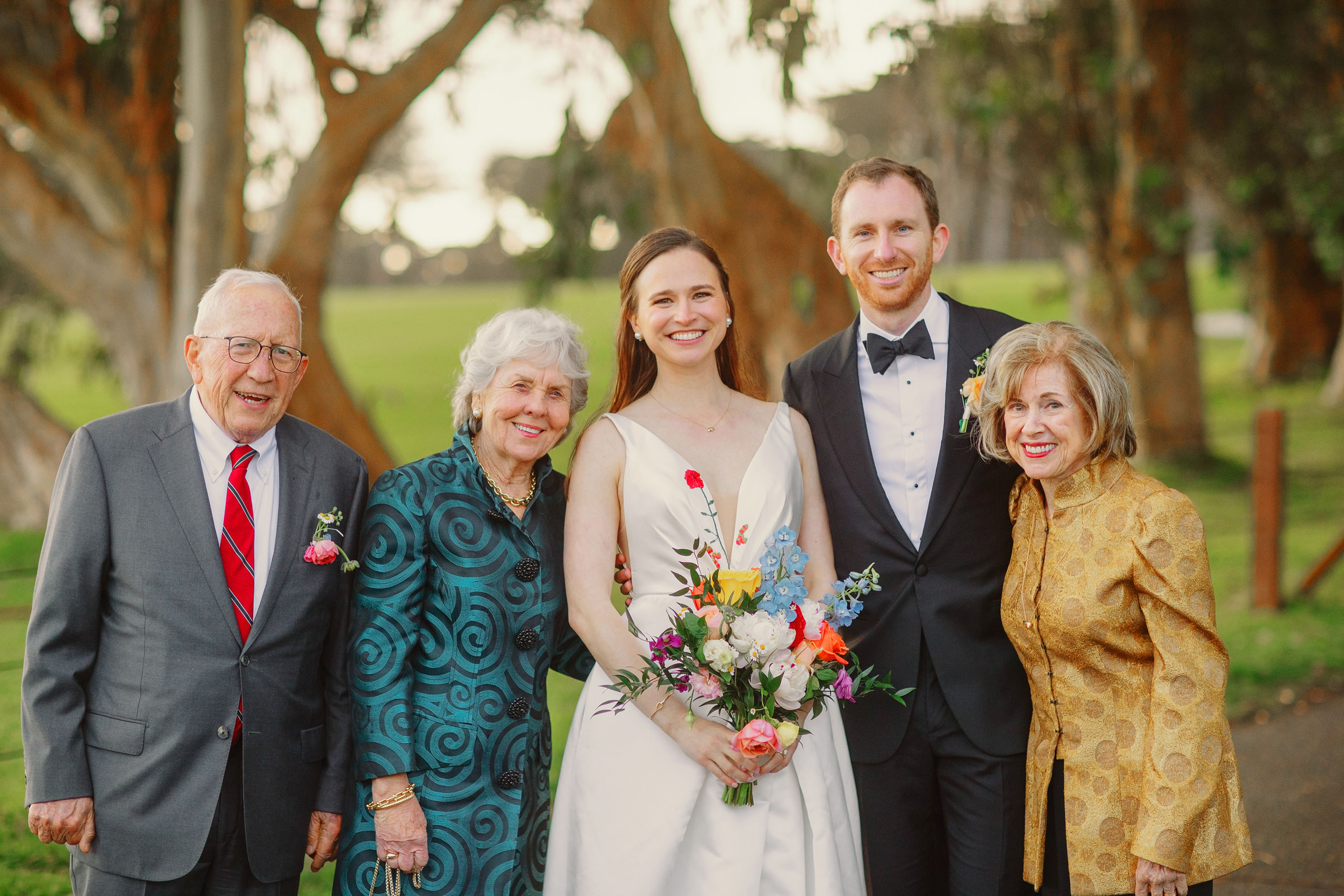 Bride and groom with family stop for a portrait. Credit: Love Knot Photography by Isaac Klotz