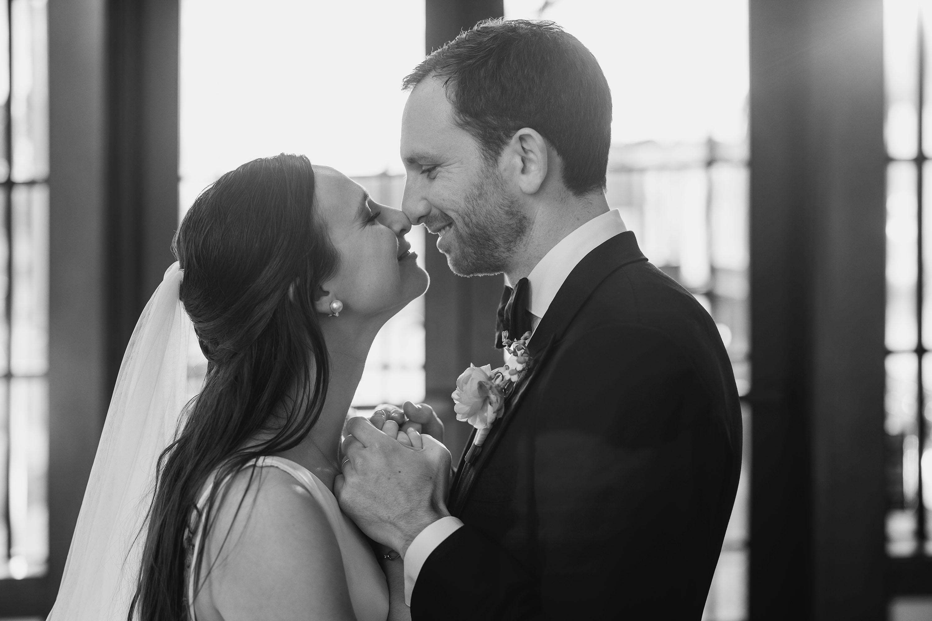 Bride and groom snuggle indoors before their grand entrance. Credit: Love Knot Photography by Isaac Klotz