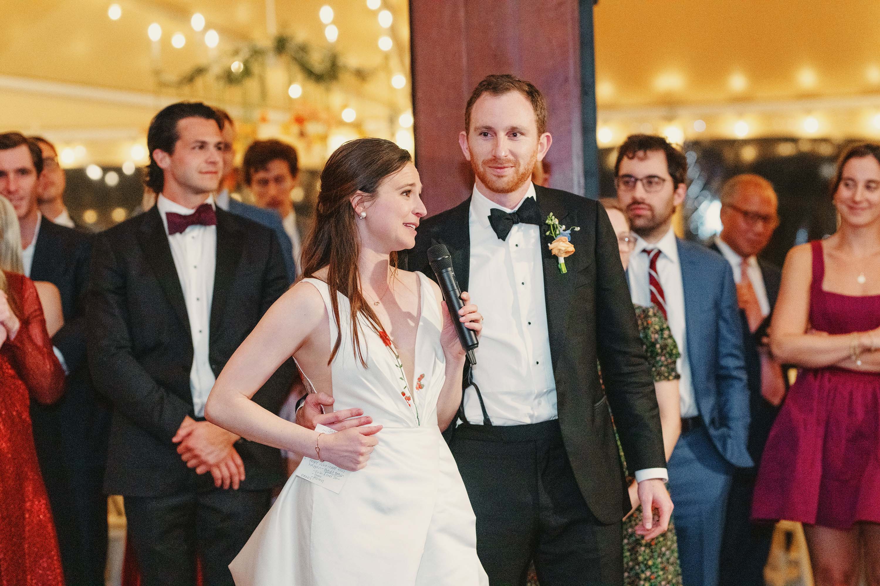 Bride and groom give a speech during their wedding reception. Credit: Love Knot Photography by Isaac Klotz