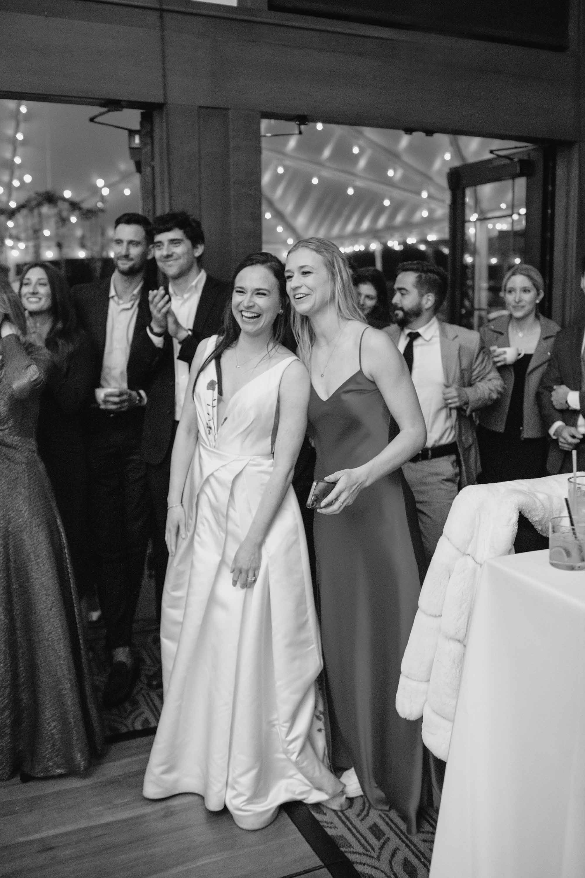 Bride watches the groom and his mother dance at the wedding reception. Credit: Love Knot Photography by Isaac Klotz