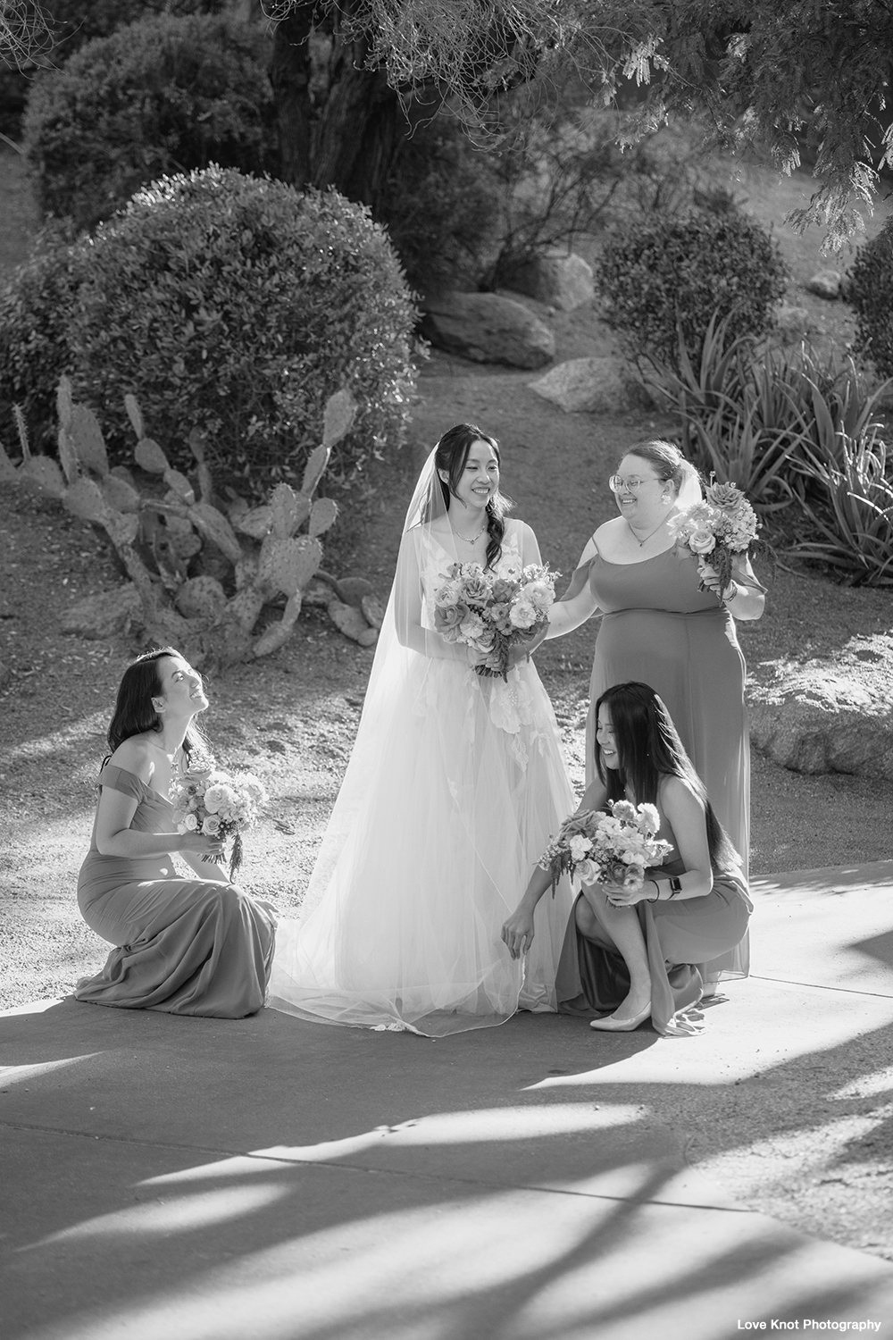bridesmaids prep bride moments before wedding ceremony
