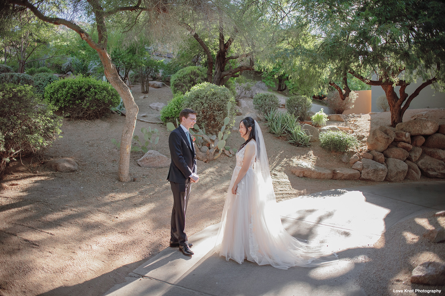 bride and groom see each other at first look on wedding day, photographed by Love Knot Photography