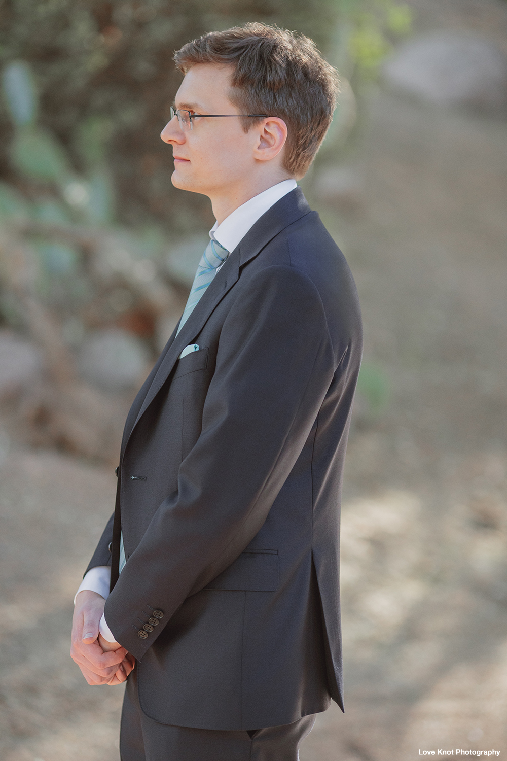 wedding day photo of groom at first look