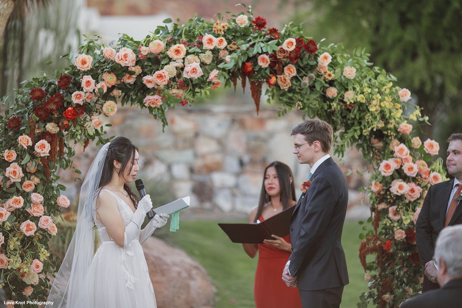 gorgeous candid moment at wedding ceremony, bride vows
