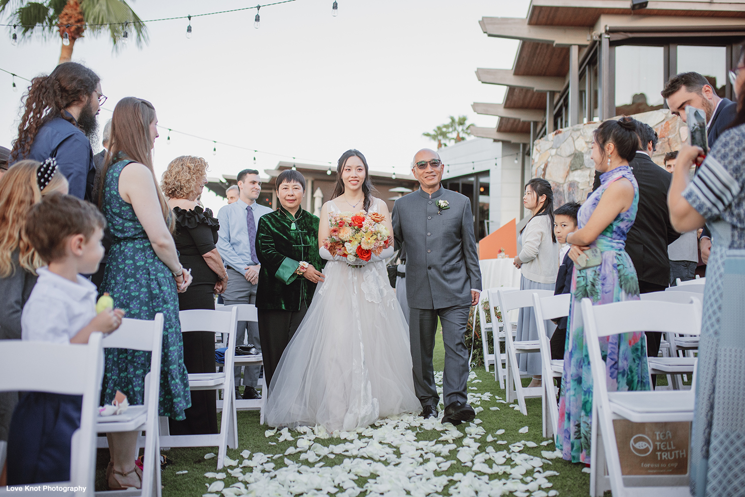 wedding photo of bride walking down aisle