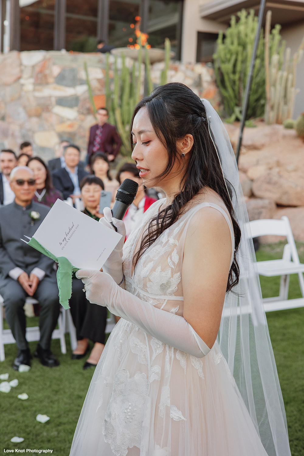 bride gives vows during candid moment at wedding ceremony