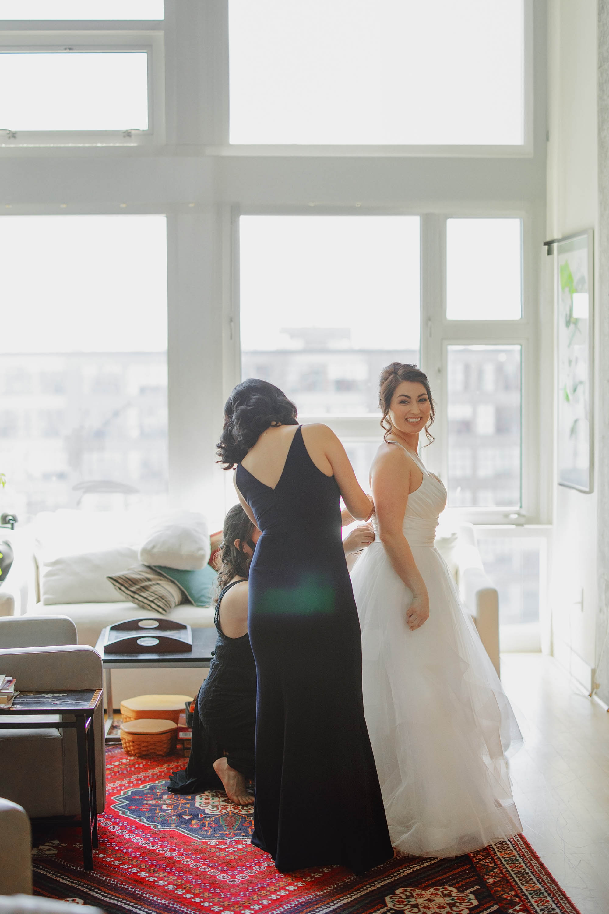 bride getting ready with bridesmaids before first look