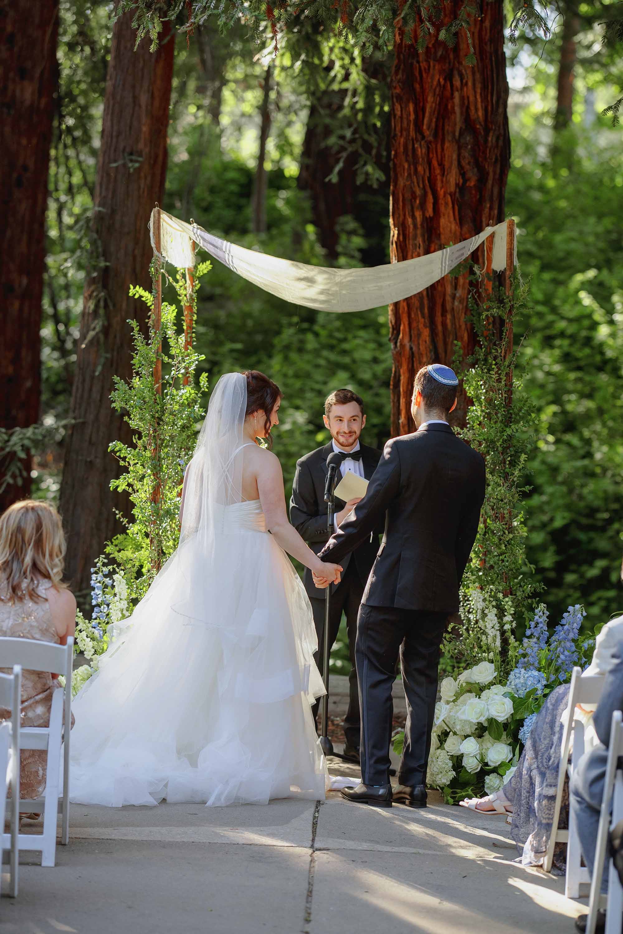 bride and groom in candid moment during wedding ceremony