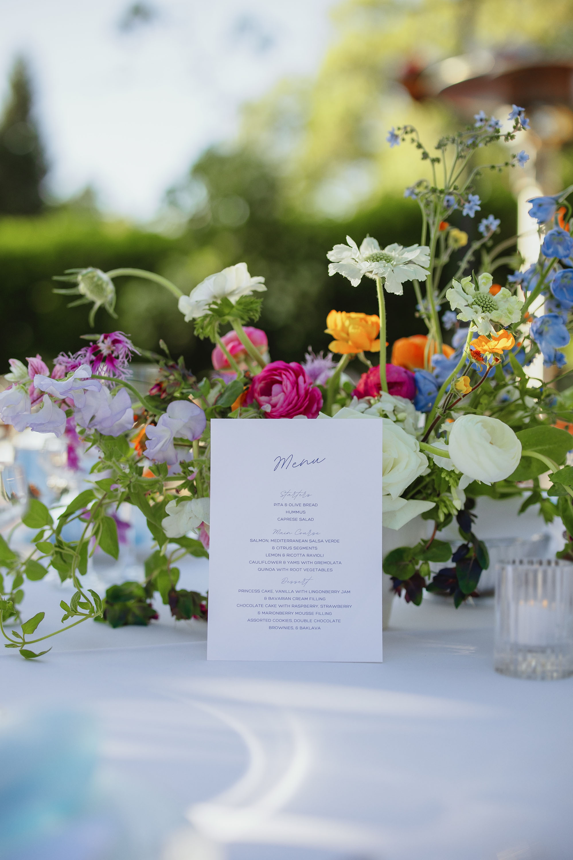 wedding day detail photo of florals with menu