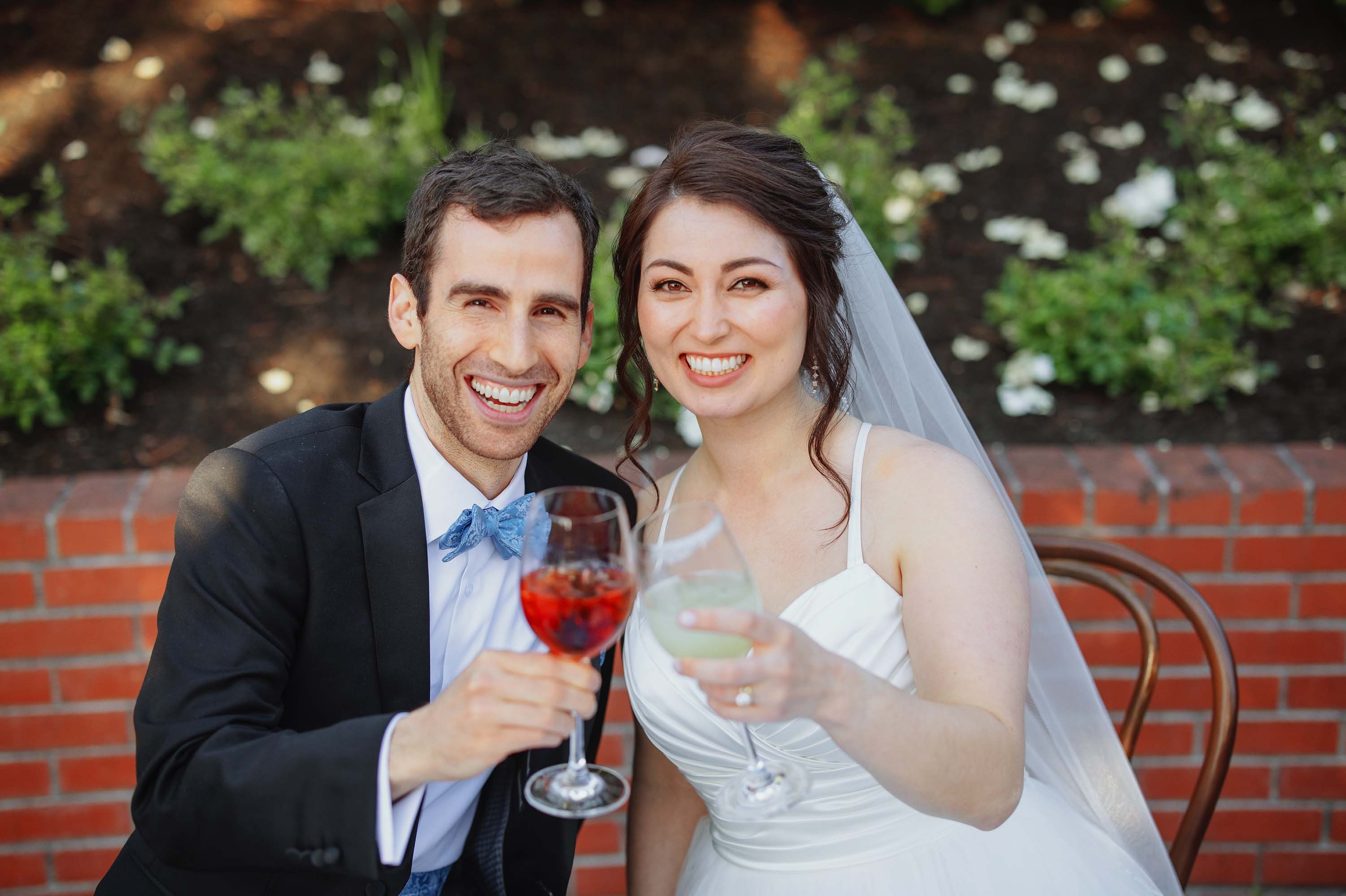 true to color photo of bride and groom cheers moment at wedding reception