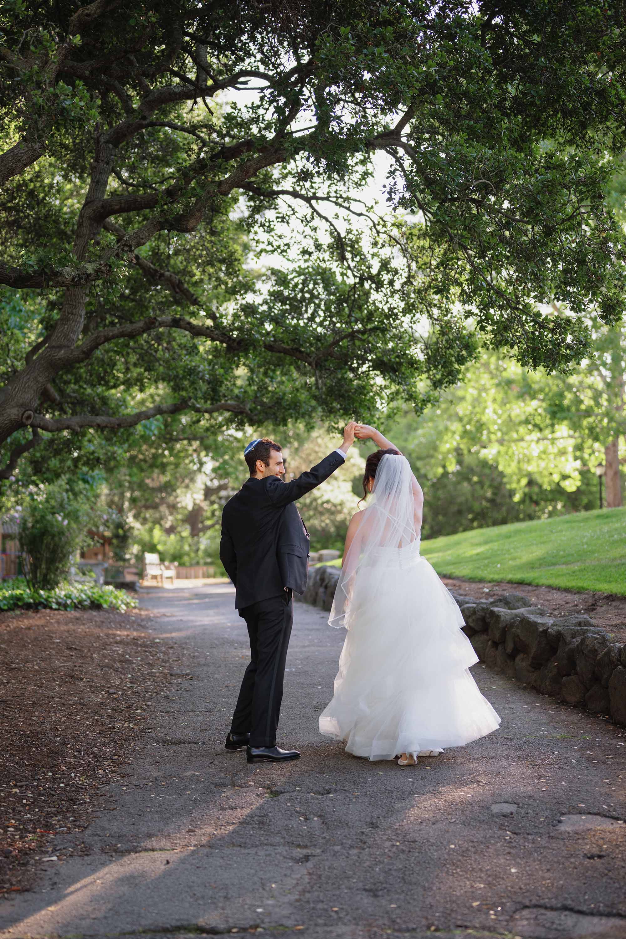bride and groom practice their first dance during sunset portrait session