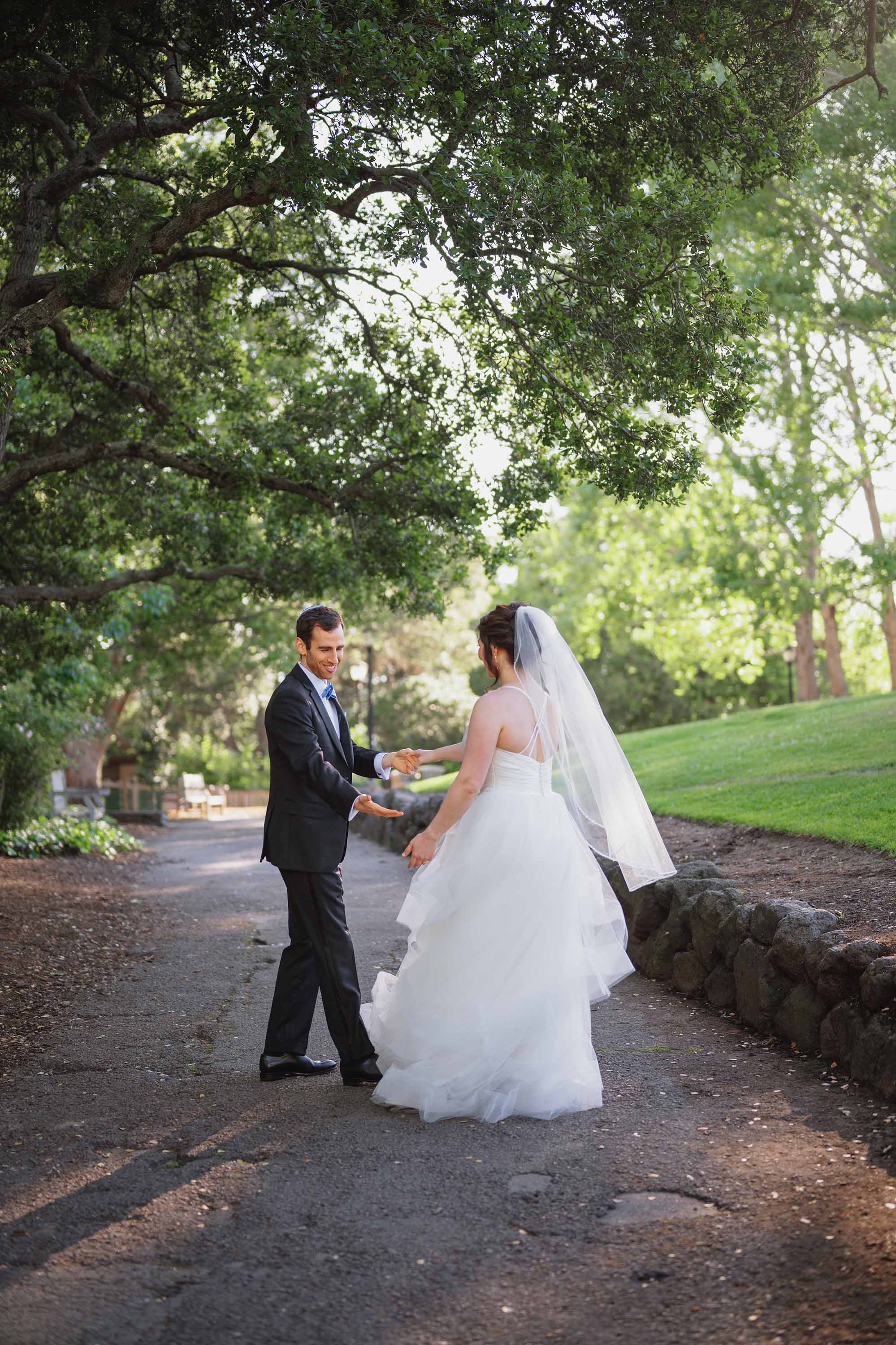 bride and groom practice first dance in this photo captured by Love Knot Photography