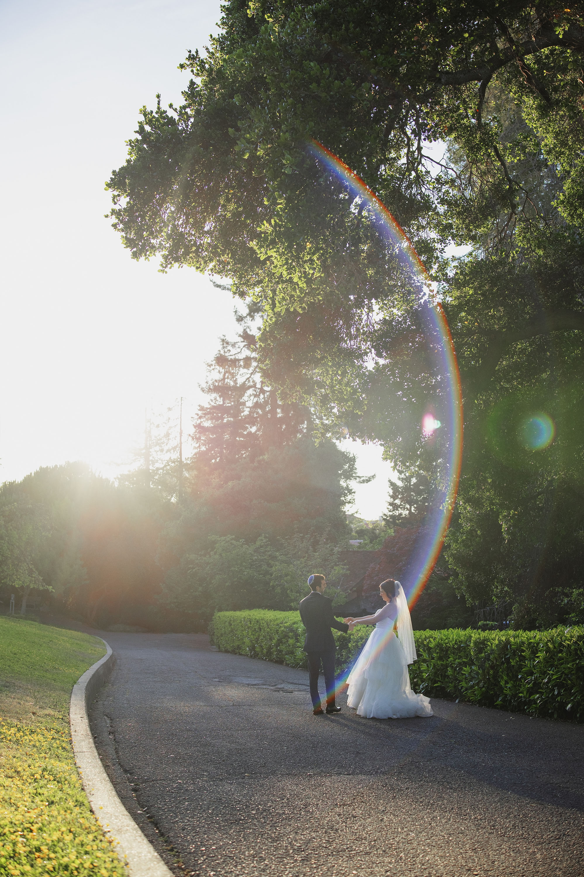 bride and groom candid moment during golden hour photoshoot on wedding day